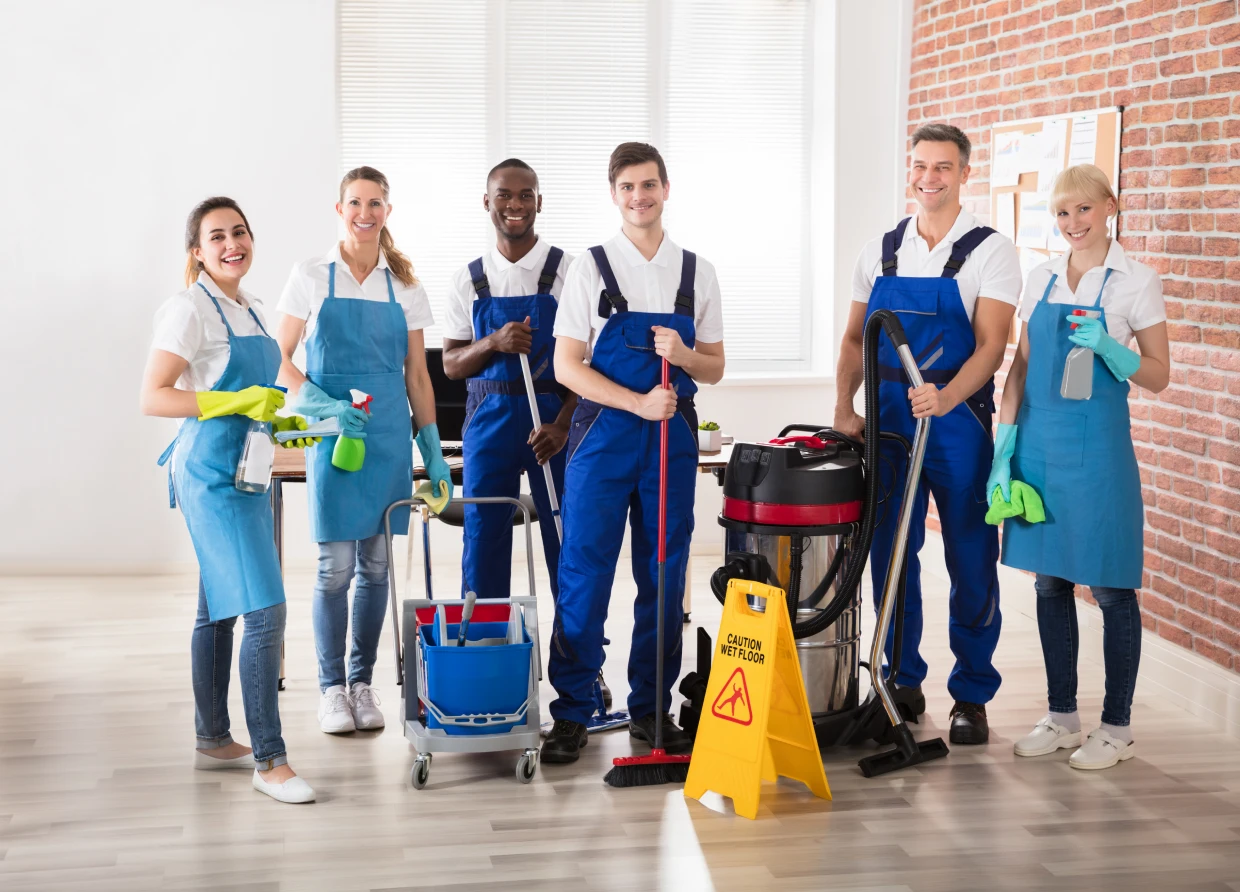 Team of janitors standing together